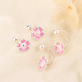 Boucles d'oreilles fleurs à cinq pétales ornées de diamants